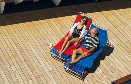 Photo: Man and woman relaxing on ship deck