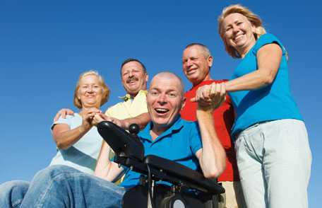 Group of friends with man in wheelchair