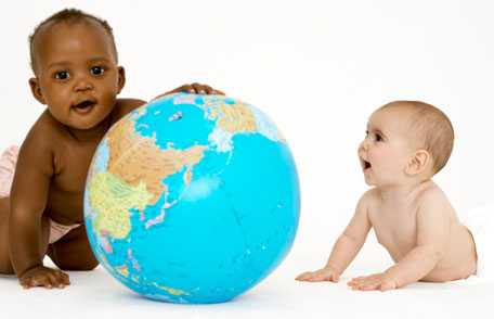 Two babies with globe
