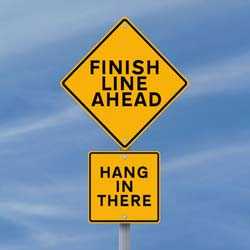 Sign that read Finish Line Ahead and Hang in There