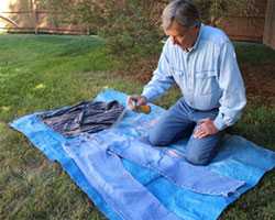 Man getting clothes ready for hunting trip