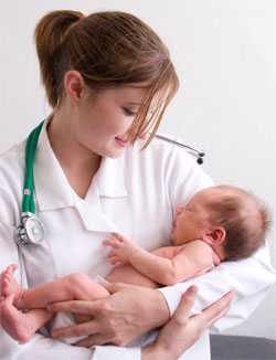 Doctor holding baby