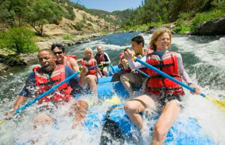 Group of people white water rafting