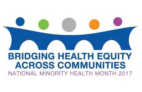 People holding signs - April is Minority Health Month