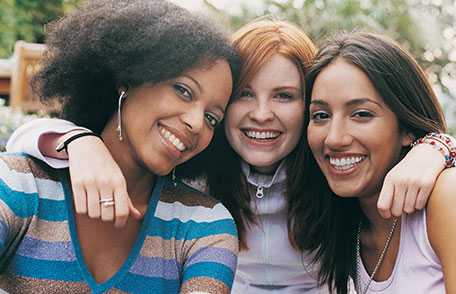 Three women smiling