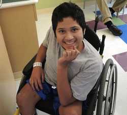 Boy with spina bifida in wheelchair