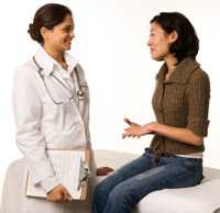 Photo: Woman talking to doctor