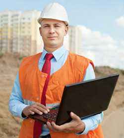 Worker on site with laptop