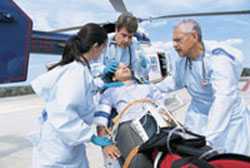 Doctors escorting patient from emergency helicopter