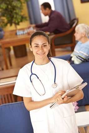 Photo of a woman working in health care as an aid at a long-term care facility.