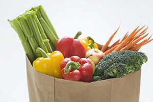 fruits and veggies in grocery bag
