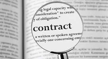 contracts with magnifying glass