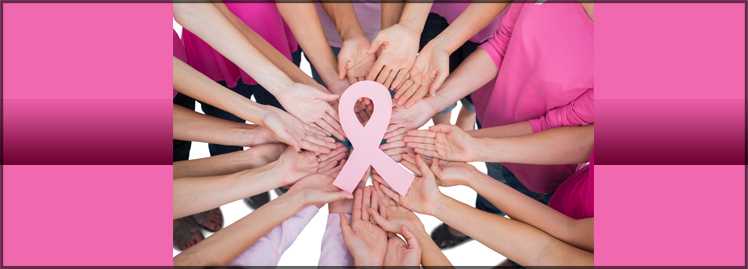 an image of hands holding a pink ribbon
