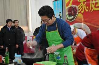 Photo of cook making a meal in a wok in China.