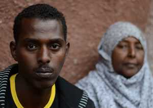 Mohamed, age 25, with his mother, Amina. His mother has been a refugee since 1991 and raised her two children in refugee camps