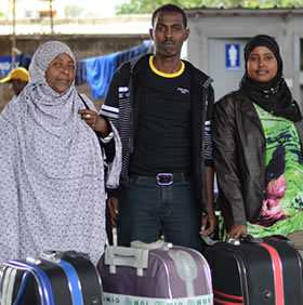 	Amina with her two children Mohamed and Sundes. 12 years after fleeing her homeland of Somalia, she is finally going to put down roots and settle into a permanent home.