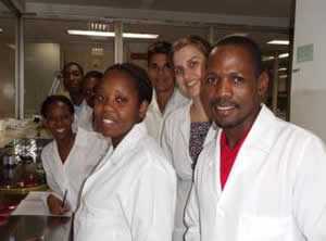 An image of CDC staff and local laboratorian in the lab