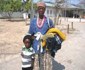 Namibia boy with stripe shirt and mom