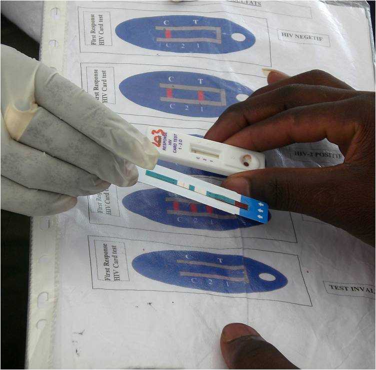 CDC staffer assists a client to interpret the results of an HIV test