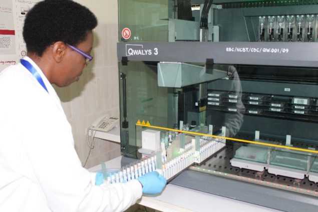 Picture of a Rwanda National Center for Blood Transfusion (NCBT) staffer using a QWALYS 3 – Blood grouping and cross matching machine bought with support from CDC Rwanda. 