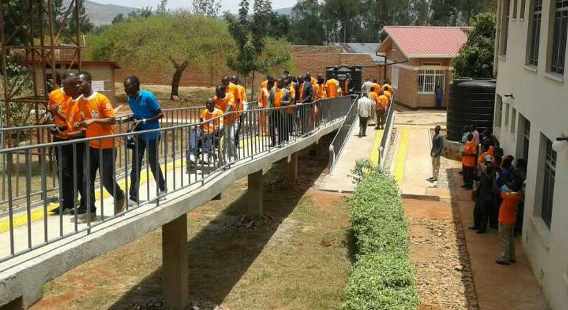 	UPHLS members and partners use a newly renovated access ramp at a health facility in Rwanda. This is one of several health facilities renovated for easier access by HIV/AIDS patients with disabilities. (Photo: CDC Rwanda)