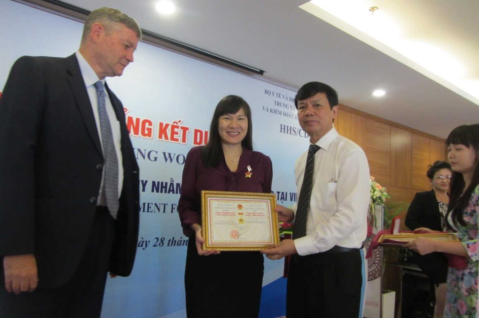 	Asia Nguyen receiving her certificate