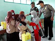A team from the district health office and police respond to a diphtheria outbreak at a junior high school in Bondowoso District, East Java, Indonesia in June 2011. 37.9% of children at the school were suffering from diphtheria. 