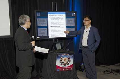 Dr. Qin Wei of China presents his interactive poster presentation.
