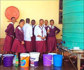 Students collect water at a high school in South Africa. 