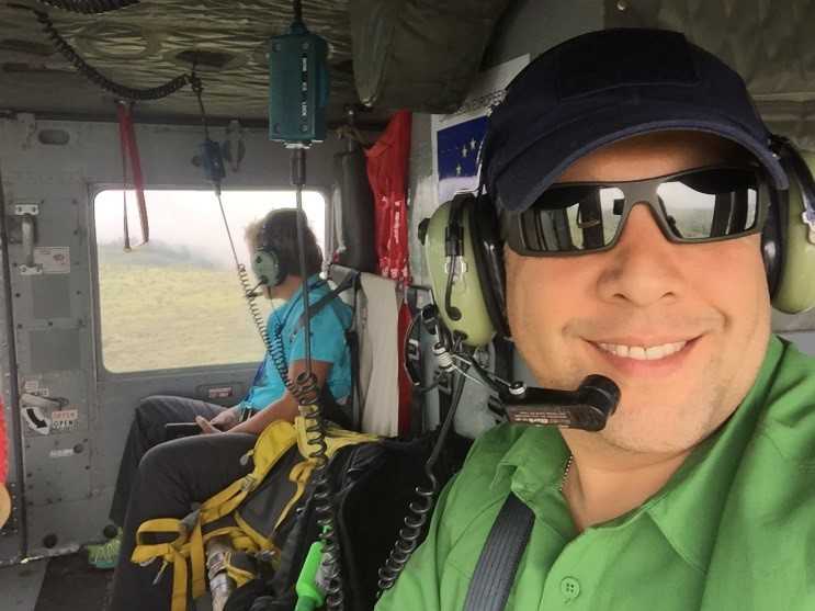 	Lara Rook of Public Health Canada Agency and Luis Hernandez helicopter to Faranah, Guinea to provide training in Emergency Management and EOC Management, May 2015.