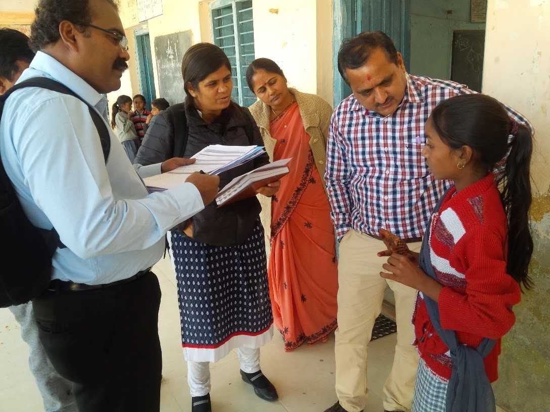 An India EIS officer helps the district rapid response team take interviews after a food poisoning outbreak in Gujarat. Photo courtesy of Mayank Dwivedi.