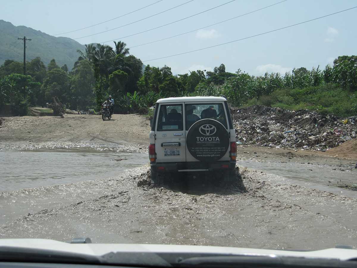 Water and weather conditions can also make areas hard to reach. In Haiti, vaccination teams encountered flooded roads while traveling to conduct immunization activities.  Volunteers meet the teams to help guide them to the communities on the other side of the flooded road.  