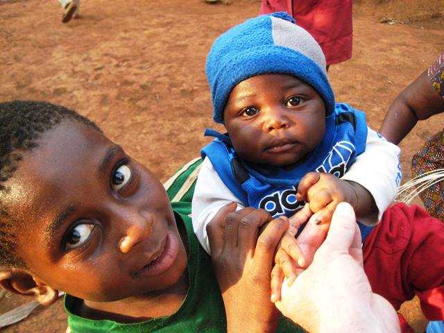 Cameroon: The temporary mark on this baby’s finger verifies that he received the polio vaccine.