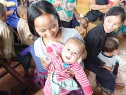 Moms and their kids at an immunization session in Lao-PDR. Photo courtesy of Karen Hennessey, CDC.