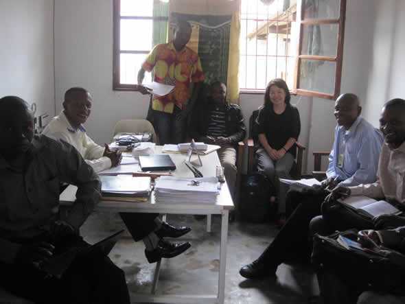 	CDC’s Chung-won Lee with members of the National Expert Group on Data Quality and health staff in Lukonga, Kasai Occidental during a post-data quality assessment debriefing session. Photo courtesy of Daline Derival/CDC.