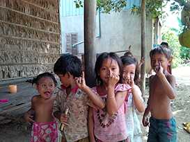 	Young children show off their purple pinkies to confirm that they have received the measles-rubella vaccine during the November 2013 campaign. Photo courtesy of Sue Chu/CDC. 
