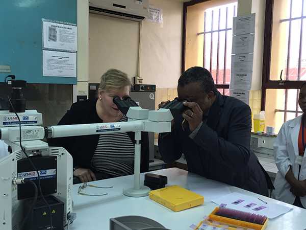 In Kinshasa, Democratic Republic of Congo (DRC), Dr. Rebecca Martin, Director of CDC’s Center for Global Health, and Dr. Jean-Jacques Muyembe, Director-General of the DRC National Institute for Biomedical Research (INRB), check out new lab equipment and examine malaria sporozoites under the lens. Mosquitoes carry these parasites, which can cause infections of malaria in humans. So far 5,000 lab techs have been trained in malaria diagnostics and surveillance through a partnership between DRC’s Ministry of Health and CDC.