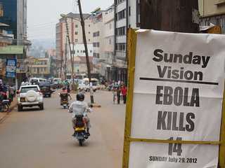 Newspaper headline: "Sunday Vision - Ebola kills 14 - Sunday, July 20, 2012