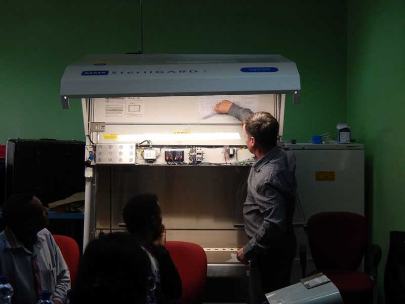 	An Eagleson Institute trainer shows how to test in-flow and down-flow on the biosafety cabinets.