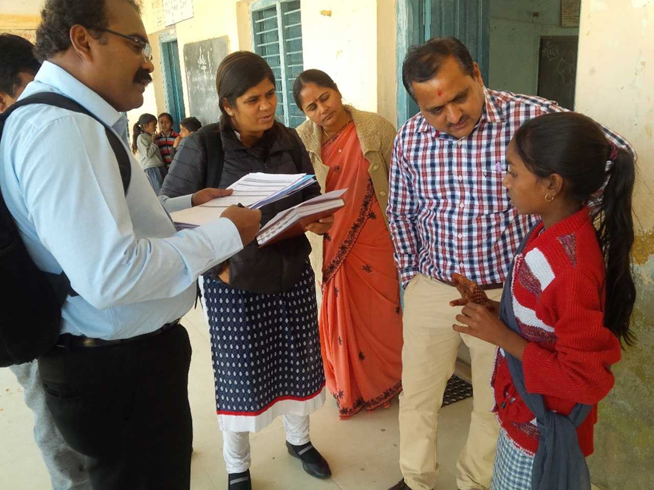 	An India EIS officer helps the district rapid response team take interviews after a food poisoning outbreak in Gujarat. Photo courtesy of Mayank Dwivedi.