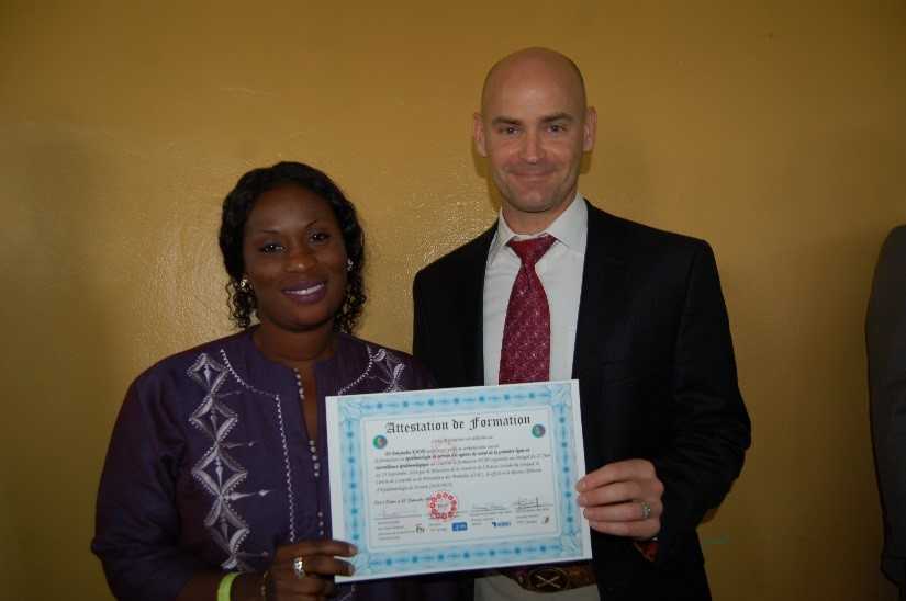 Dr. Dieynaba Kane at the FETP Frontline graduation ceremony with CDC Senegal Country Director, Dr. Michael Kinzer 