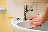 washing hands in a basin