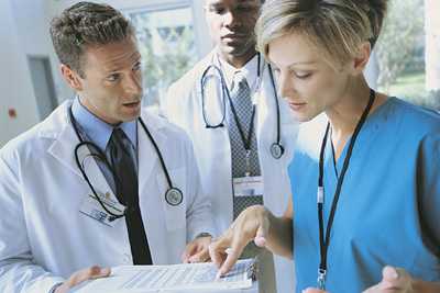 Physicians reviewing paperwork