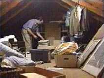 man cleaning attic space