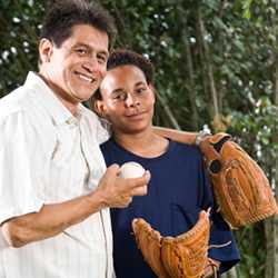	Father and teenage son with a baseball glove and ball
