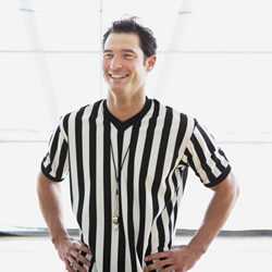 	photo of smiling referee