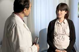 woman speaking with medical professional