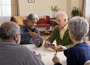 	Photo of elderly adults playing cards