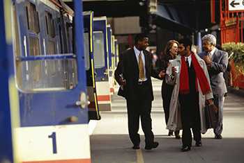 Business people walking on train platform