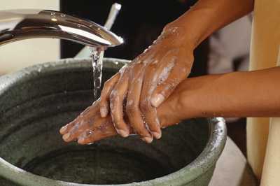 	a person washing their hands